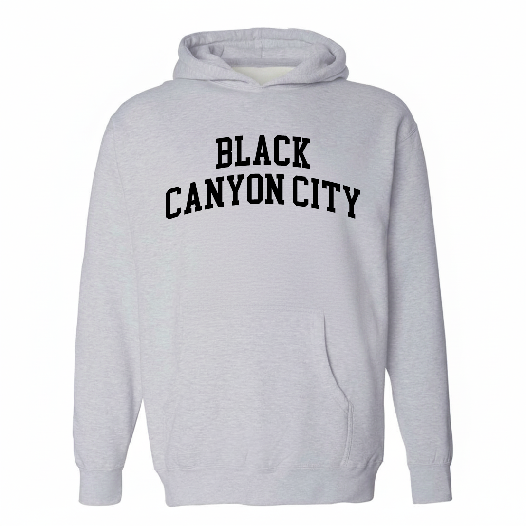 Heather-gray hoodie with the Black Canyon City varsity arched lettering design on the chest.
