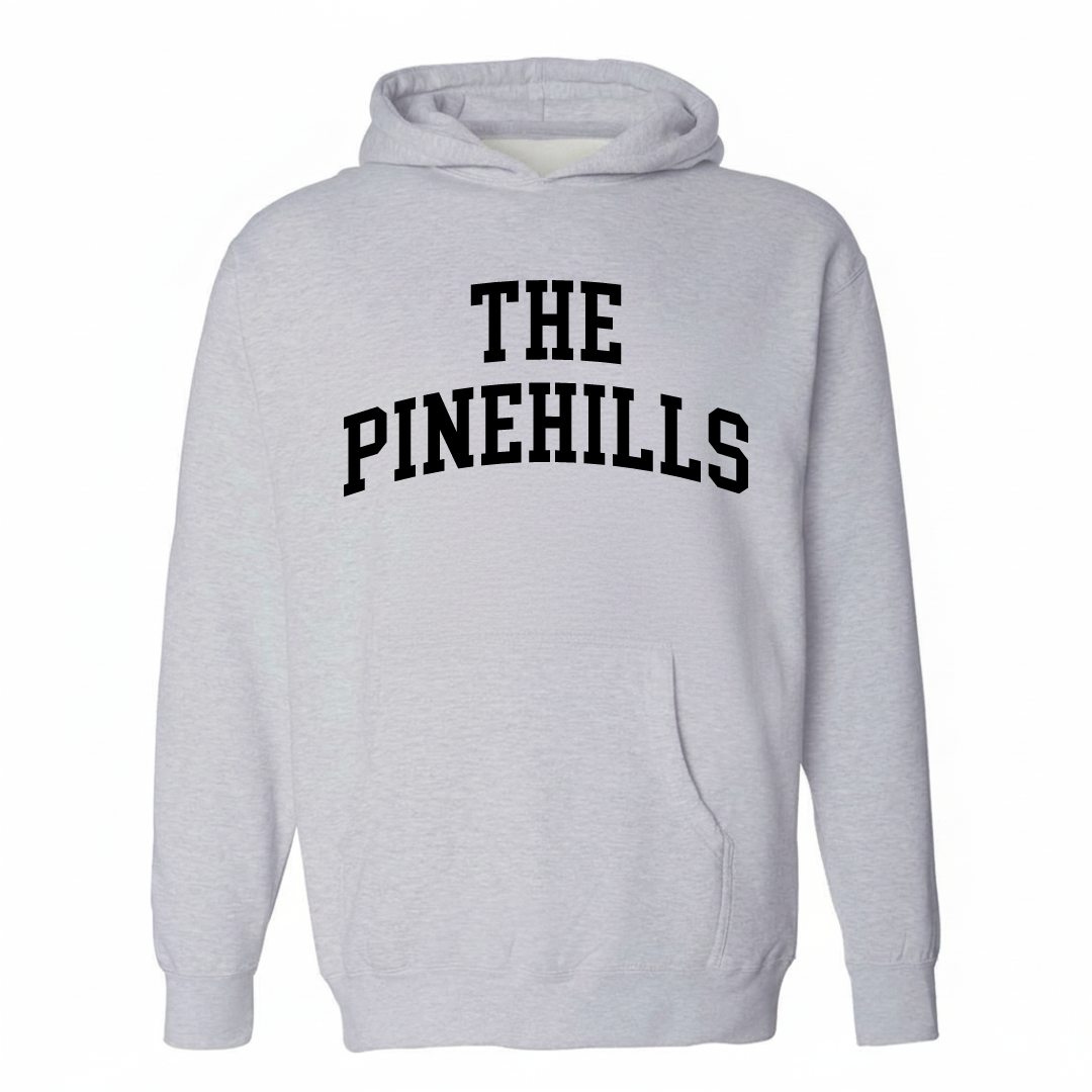 Heather-gray hoodie with The Pinehills varsity arched lettering design on the chest.