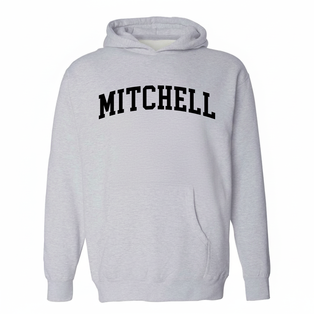 Heather-gray hoodie with the Mitchell, NE varsity arched lettering design on the chest.