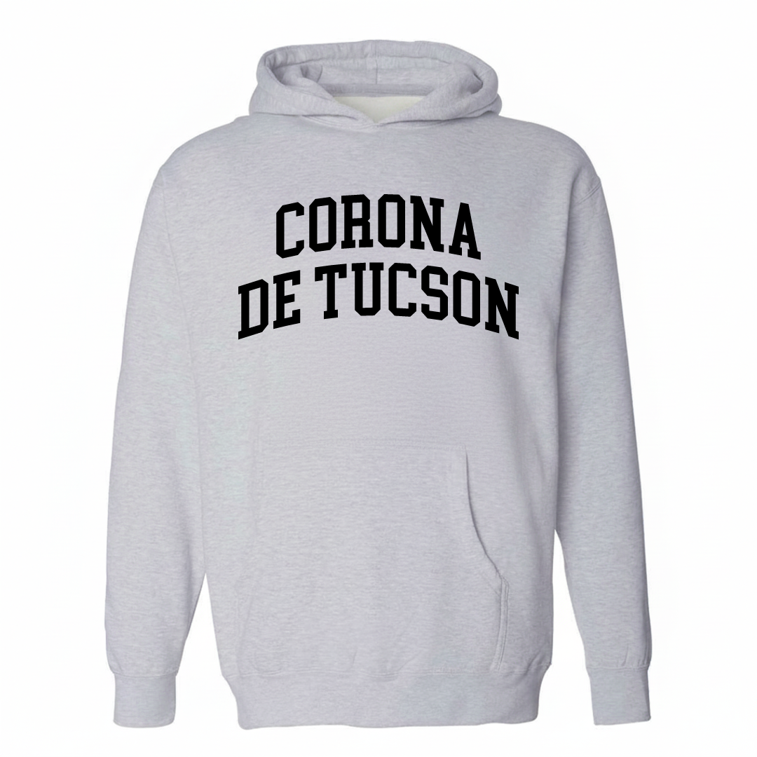 Heather-gray hoodie with the Corona de Tucson varsity arched lettering design on the chest.
